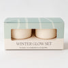 Boxed set of two candles labeled 'Winter Glow Set' on a white background